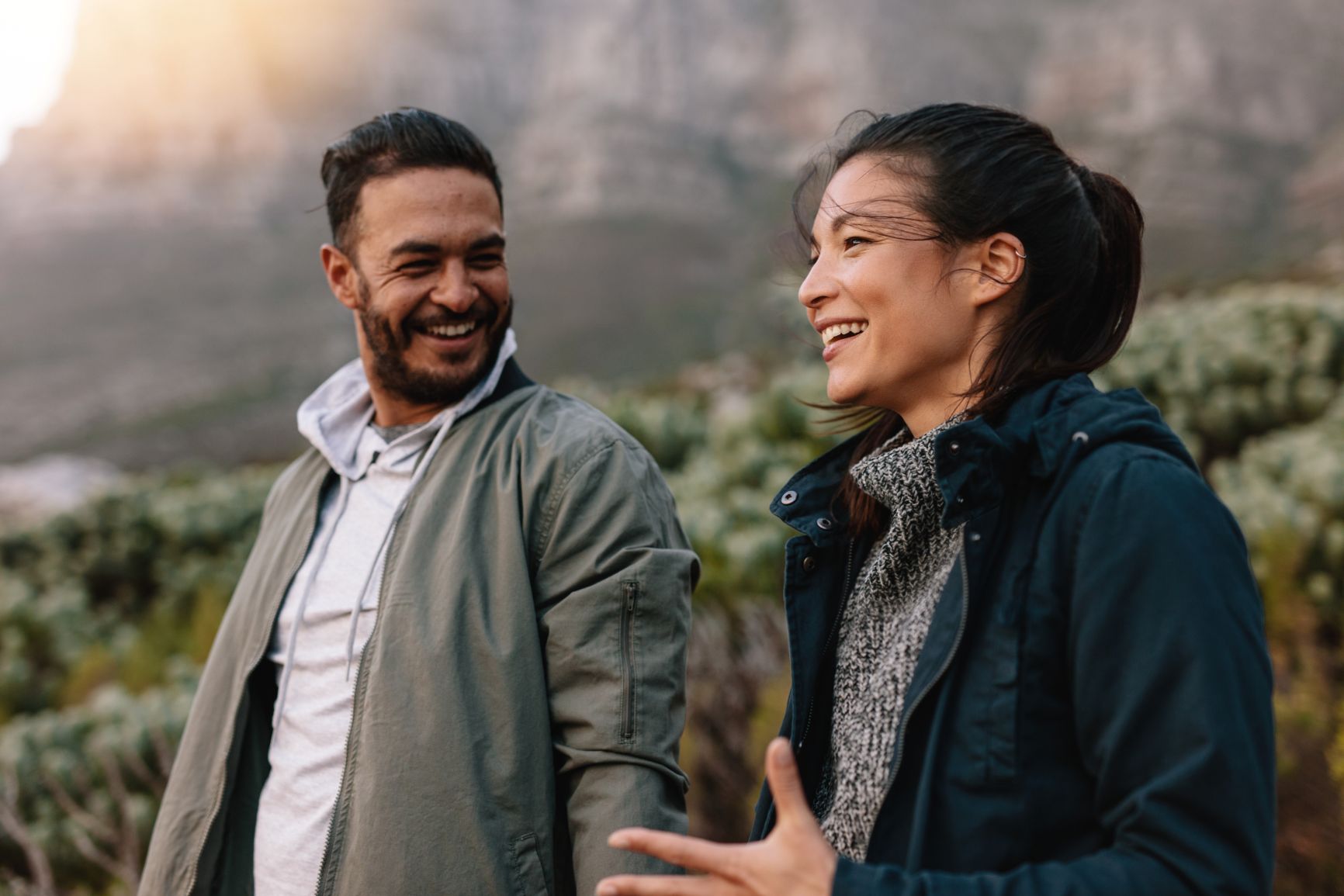 Man and woman conversing and walking together