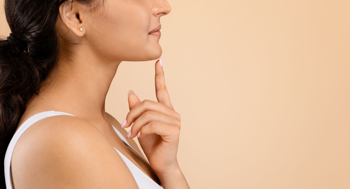 side closeup woman touching chin